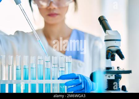 Test tubes with liquid in modern laboratory Stock Photo