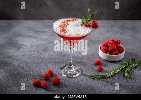 Red Clover Club Cocktails with Layered Egg White Foam. Summer refreshing alcoholic cocktails. Raspberry lemonade garnished with Stock Photo