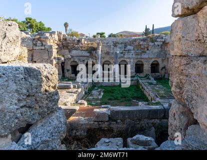 View of the Pirene Fountain ruins in Ancient Corinth in Southern Greece Stock Photo