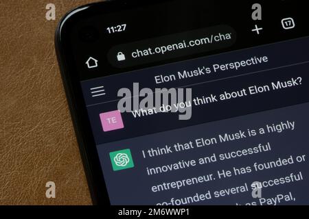 ChatGPT, a prototype AI chatbot developed by OpenAI that specializes in dialogue, is seen answering a question about Elon Musk, on a smartphone. Stock Photo