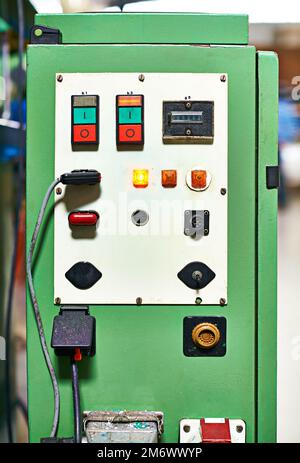 This is all youll need to get the job done. Closeup shot of a control panel on some machinery equipment. Stock Photo