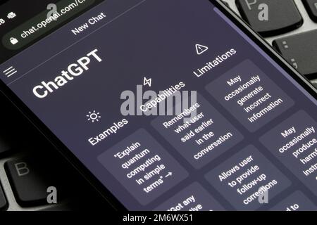 Webpage of ChatGPT, an AI chatbot, is seen on the website of OpenAI, on a smartphone. Examples, capabilities, limitations are shown before a new chat. Stock Photo