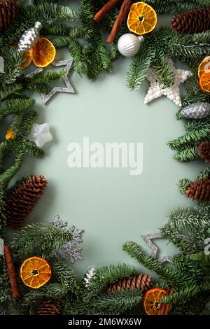 Christmas holiday background with copy space for text. Fir tree branches with Christmas balls frame. Stock Photo