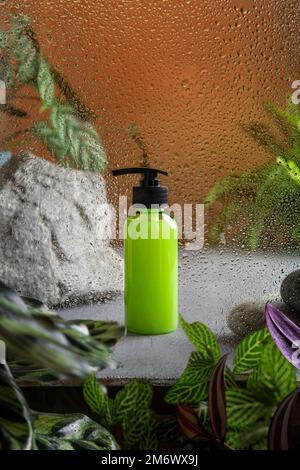 Ð¡osmetic product branding with tropical leaves on tan color background. Cosmetic product ad with natural cosmetics ingredients Stock Photo