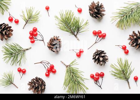 Christmas background, floral pattern of pine tree branches and cones on white background, flat lay texture Stock Photo