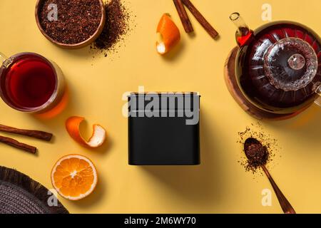 Black metal packaging for tea. Tea branding and packaging mockup. Blank tea packaging mockup with tea to display your branding d Stock Photo