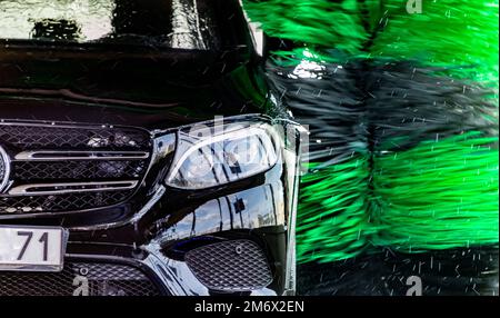 A vehicle in an automatic car wash. Stock Photo