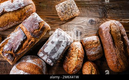 Composition with assorted bakery products on wooden table. Stock Photo