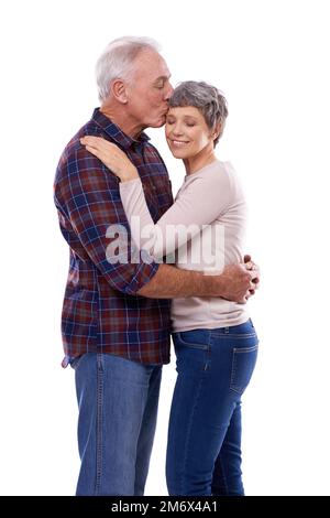 Shes my special lady. Studio shot of an affectionate elderly couple isolated on white. Stock Photo