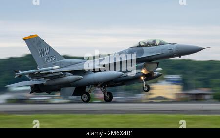 An F-16 Flighting Falcon assigned to the 14th Fighting Squadron, Misawa Air Base, Japan, lands at Yokota Air Base, Japan, to participate in a week-long Agile Combat Employment training exercise aimed at enhancing multi-capable Airmen’s skillset, May 8, 2022. Twelve 14th FS F-16s and crew members deployed to Yokota AB to participate in the exercise. Through ACE, the 35th Fighter Wing train alongside the 374th Airlift Wing to maintain a competitive edge over adversaries; and execute their mission – to protect U.S. interests in the Pacific, defend Japan, and deter adversaries through presence, re Stock Photo