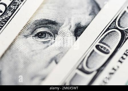 Benjamin Franklin's eyes from a hundred-dollar bill. 100 dollar bill Stock Photo