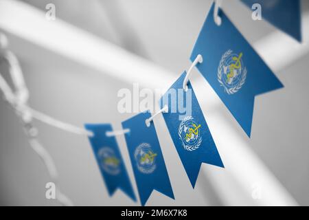 Small national flags of the World Health Organization WHO on a white ...