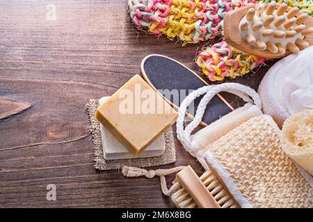 big set of bath room accessories bar soap wisp massager loofah nailbrush on vintage wooden board with small copyspace Stock Photo