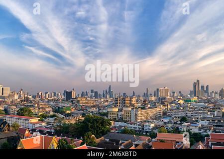 Cityscape of Bangkok city center in sunset, blue sky and clouds, Thailand.  Stock Photo