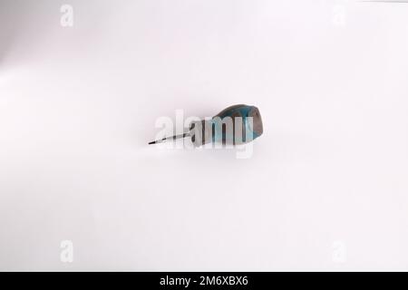 photo small screwdriver lying on a white background Stock Photo