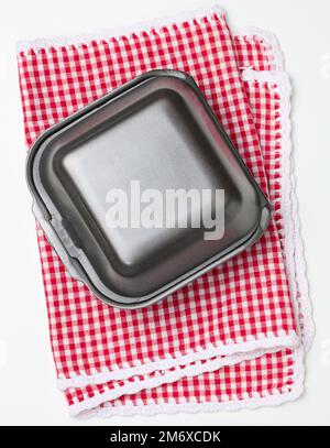 Disposable food container. Gray box of polystyrene on a white background Stock Photo