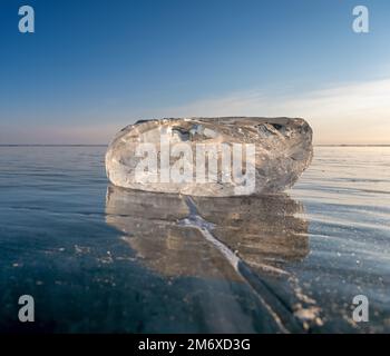 Sunlight refracted in piece of ice Stock Photo