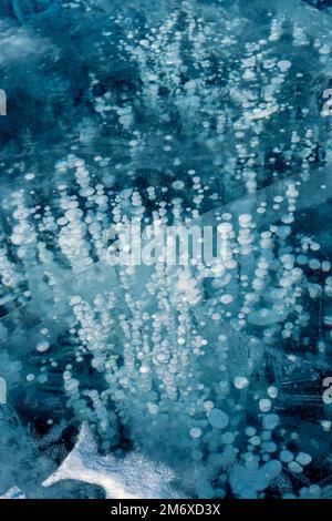 Blue ice and frozen bubbles on Baikal Stock Photo