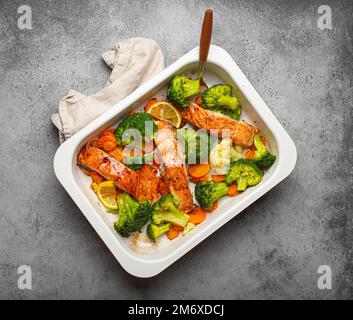 Salmon steak with vegetables cauliflower, broccoli, carrots and green ...