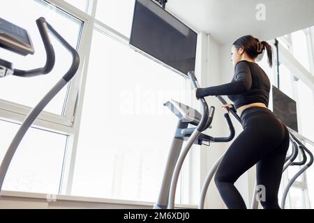 Doing cardio on the treadmill. Running on a treadmill. Stock Photo