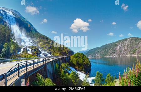 Summer mountain Langfossen waterfall on slope (Etne, Norway). Stock Photo