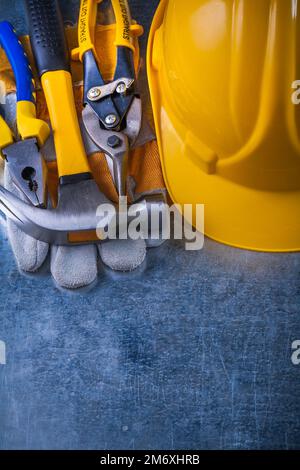 Composition of working tools on scratched vintage metallic background construction concept. Stock Photo