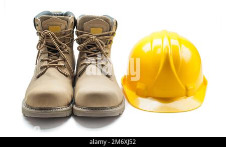 construction tools leather working boots and yellow helmet isolated on white Stock Photo