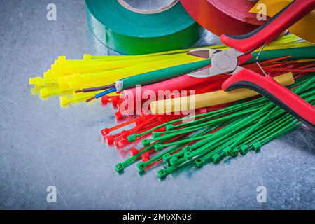 Insulating tapes plastic cable ties electric wires nippers. Stock Photo