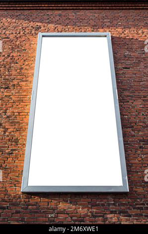 Vertical blank billboard on a brick wall Stock Photo