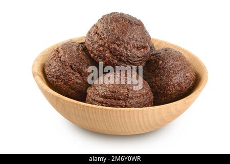 chocolate cookie with kerob, banana, cashew, sunflower seeds in wooden bowl isolated on white background. Healthy food gluten-free, flour-free Stock Photo
