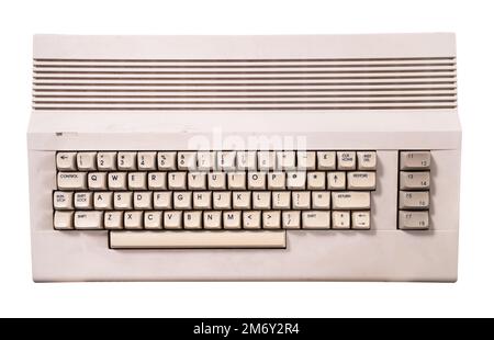 top view closeup of vintage cream colored home computer keyboard isolated on white Stock Photo