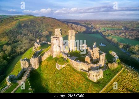 Corfe Castle, Dorset, UK.  6th January 2023.  Early morning sunshine at Corfe Castle in Dorset shortly after sunrise.  Picture Credit: Graham Hunt/Alamy Live News Stock Photo