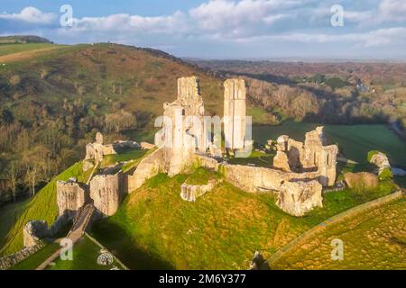 Corfe Castle, Dorset, UK.  6th January 2023.  Early morning sunshine at Corfe Castle in Dorset shortly after sunrise.  Picture Credit: Graham Hunt/Alamy Live News Stock Photo