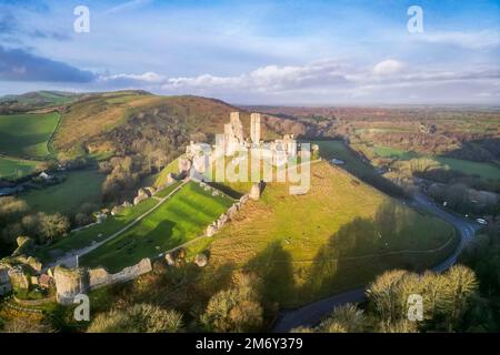 Corfe Castle, Dorset, UK.  6th January 2023.  Early morning sunshine at Corfe Castle in Dorset shortly after sunrise.  Picture Credit: Graham Hunt/Alamy Live News Stock Photo