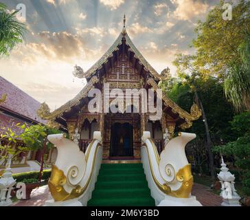 Wat Phra Singh at sunset time It is a buddhist temple in Chiang Rai Province. Northern Thailand Stock Photo
