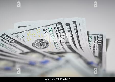 US dollar bills in 100 dollar denominations are seen in this illustration photo in Warsaw, Poland on 06 January, 2022. Stock Photo