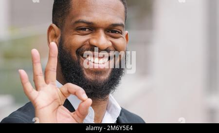 Close up portrait of smiling happy bearded African American ethnic man successful male businessman entrepreneur employer executive worker manager Stock Photo