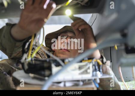 Spc. Ryan Lemon, an Unmanned Aircraft Systems Repairer assigned to the 7-17th Air Cavalry Squadron, 1st Air Cavalry Brigade performs routine maintenance on a RQ-7B V2 Shadow during Exercise Swift Response on May 10, 2022 at Krivolak Training Area, North Macedonia. Exercise Swift Response 2022 is an annual multinational training exercise, which takes place in Eastern Europe, the Arctic High North, Baltics and Balkans from May 2-22, 2022. Stock Photo