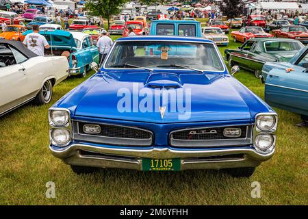 Iola, WI - July 07, 2022: High perspective front view of a 1966 Pontiac GTO Hardtop Coupe at a local car show. Stock Photo