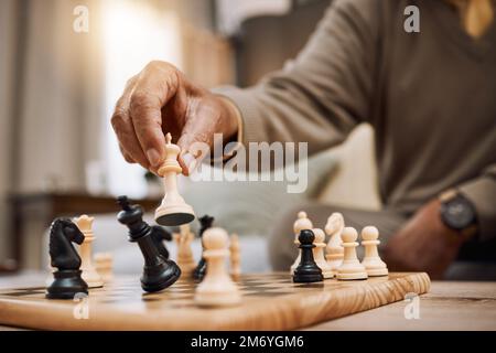 A young chess player contemplates a game plan or strategic