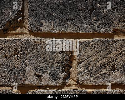 Closeup of a wall constructed of concrete blocks with deep nortar pointing in between. Stock Photo