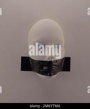 Abstract illustration of human head with taped mouth in the wall Stock Photo