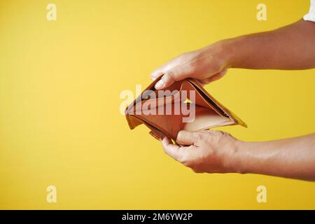 Man hand open an empty wallet with copy space. Stock Photo