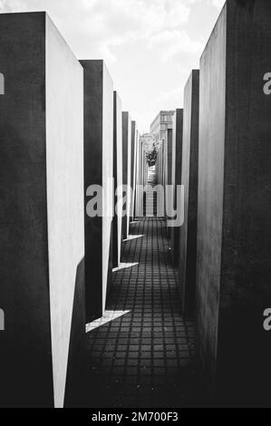 Vertical shot of a narrow space between old buildings Stock Photo - Alamy