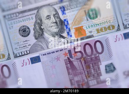 US american 100 dollars bills, European Union currency 500 euro banknotes closeup money background. USA Europe economies relations, business market, t Stock Photo