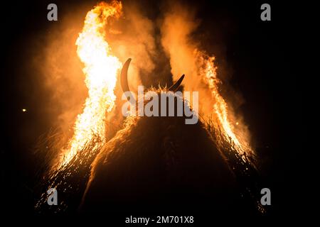 Buso by the fire during Poklade (annual Buso festivities) in Mohacs, Hungary Stock Photo