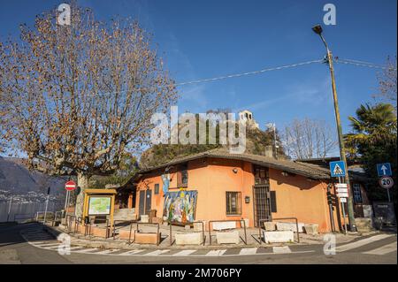 Castelveccana, Italy- 12-27-2022: Beautiful building with a church in the background in the municipality of Caldè on Lake Maggiore Stock Photo