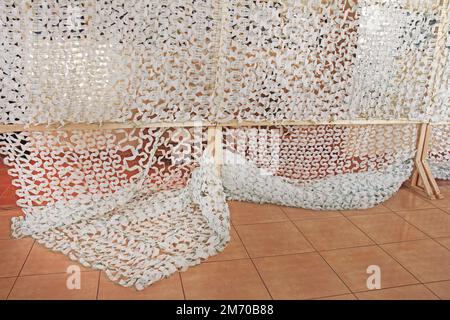 Winter camouflage netting for soldiers of the Ukrainian army Stock Photo