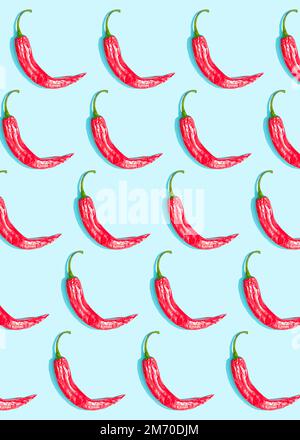 Chilli peppers pattern on blue background Stock Photo