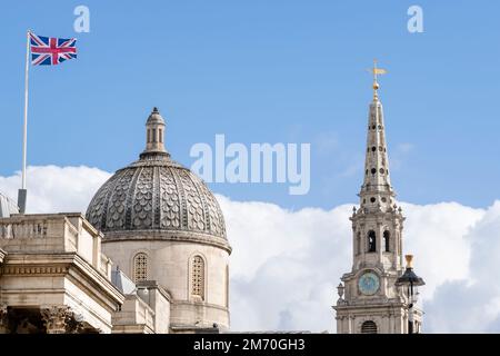 A Union Jack flag flying over The National Gallery with the spire of St. Martin-in-the-Fields in the background, The National Gallery, Trafalgar Squar Stock Photo